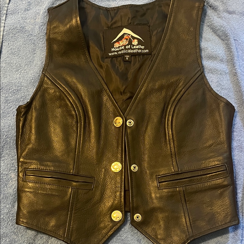 Black Leather Vest with silver buffalo snap closure.